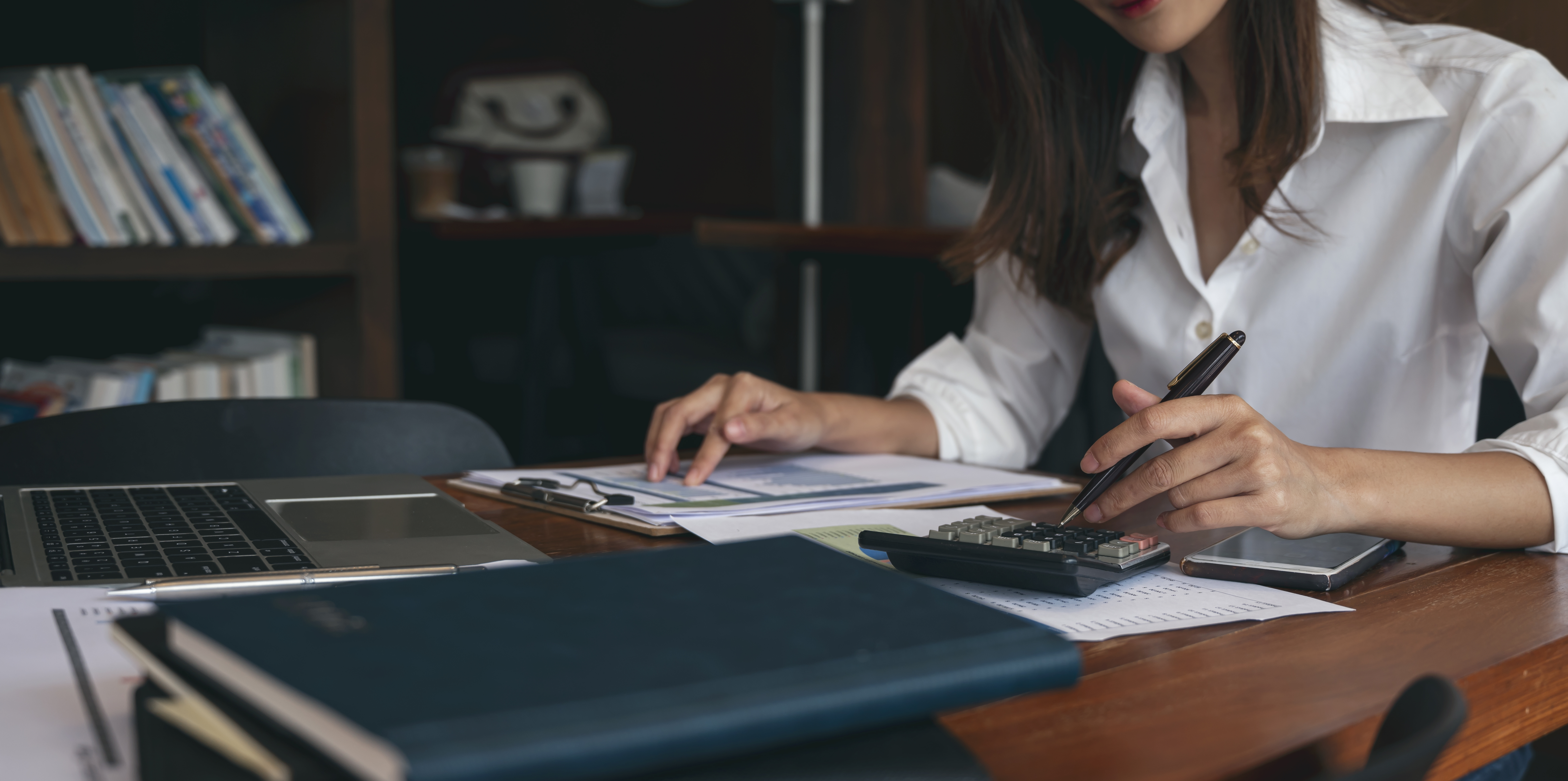 A buy to let accountant reviewing financial documents for property investment.