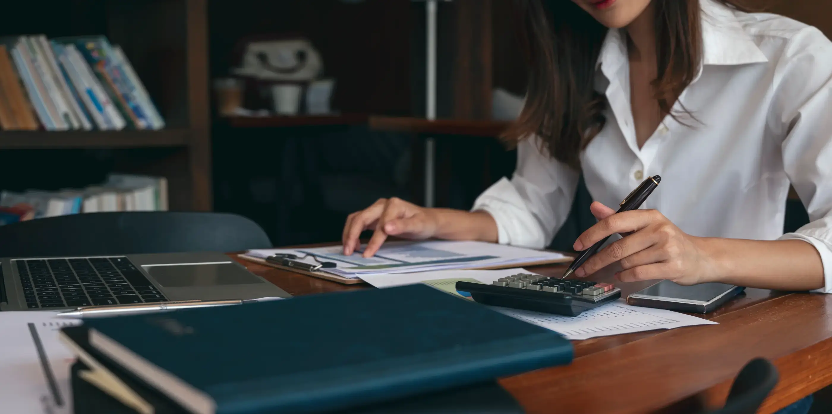 A buy to let accountant reviewing financial documents for property investment.