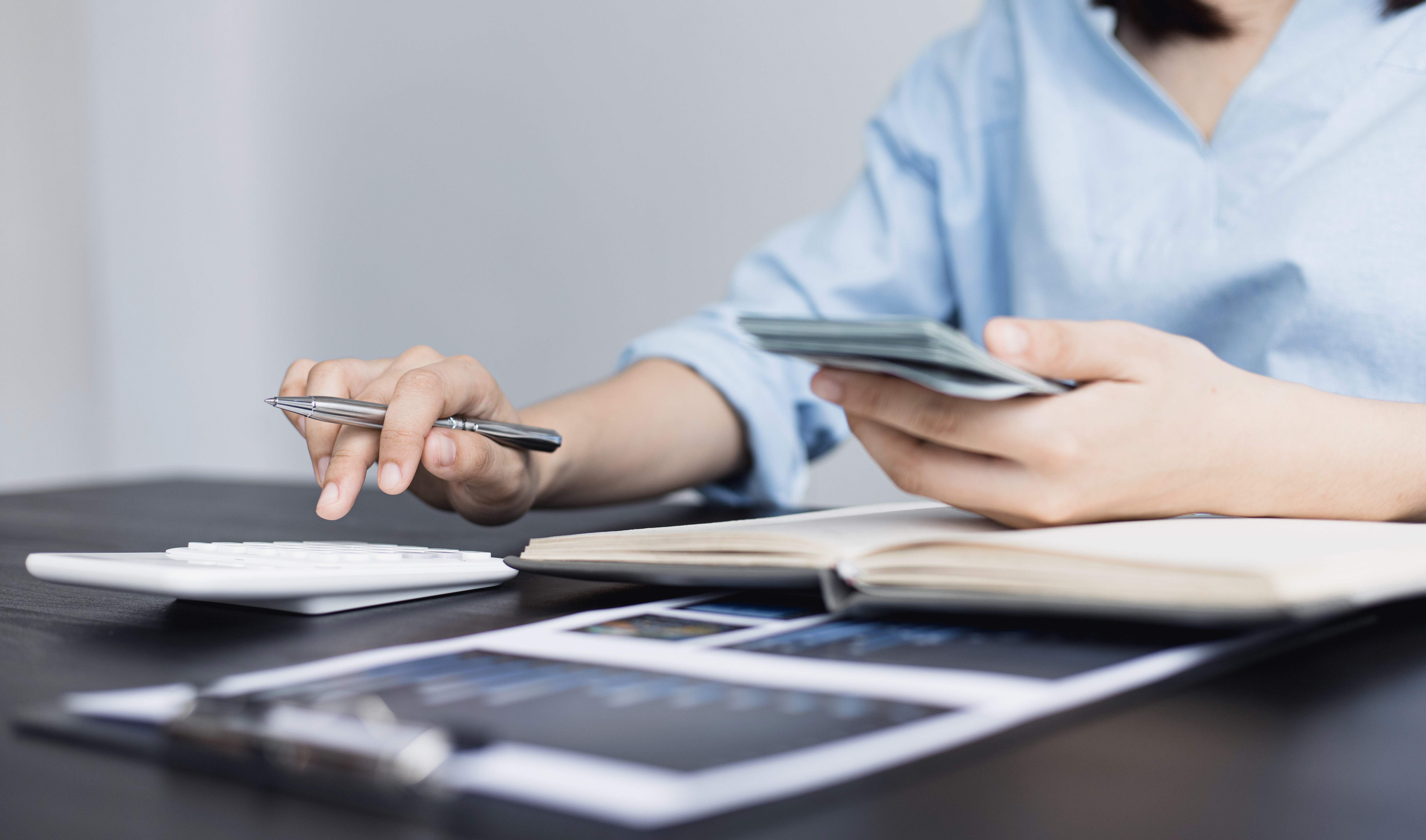 Business professional reviewing finances and auditing accounts.