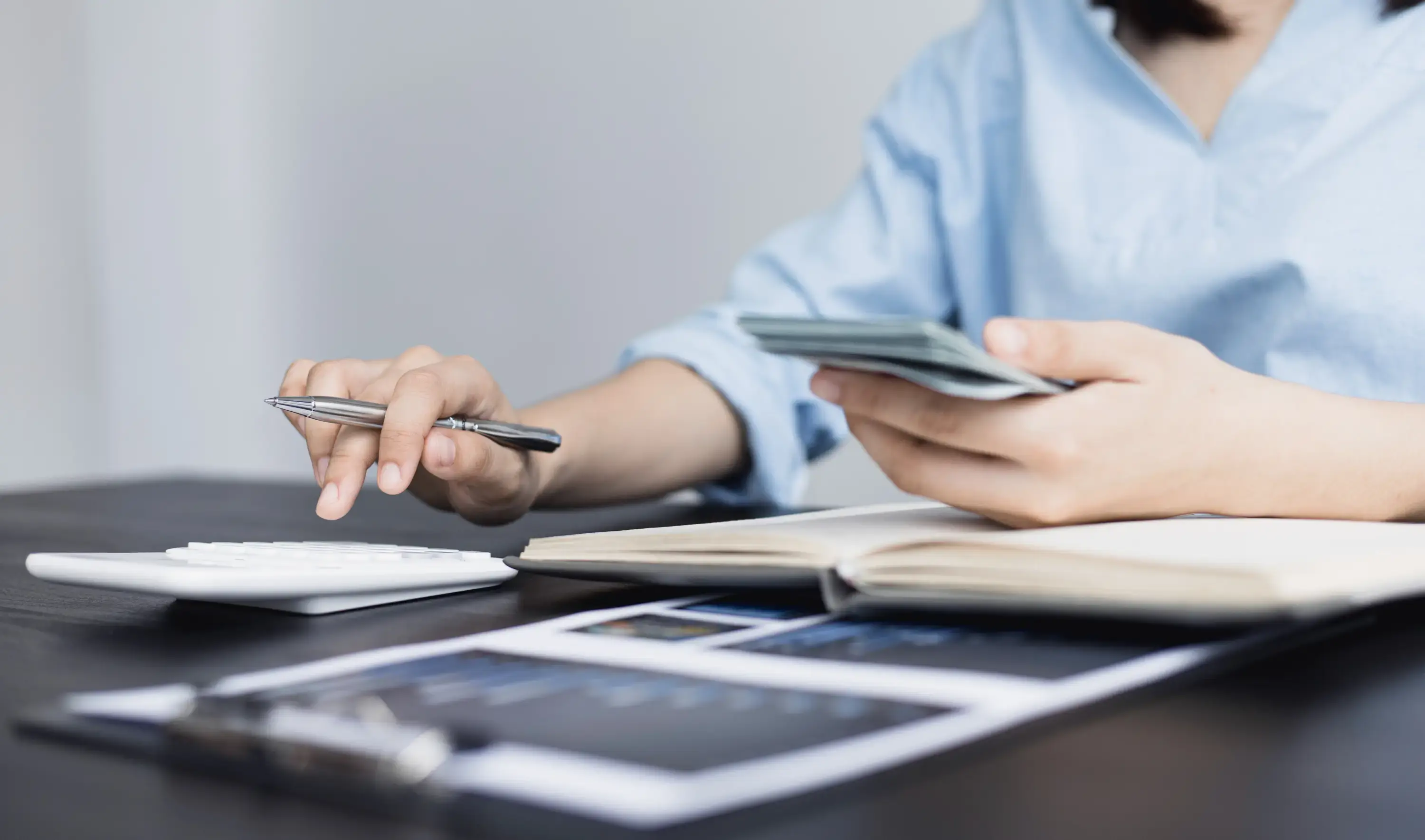 Business professional reviewing finances and auditing accounts.